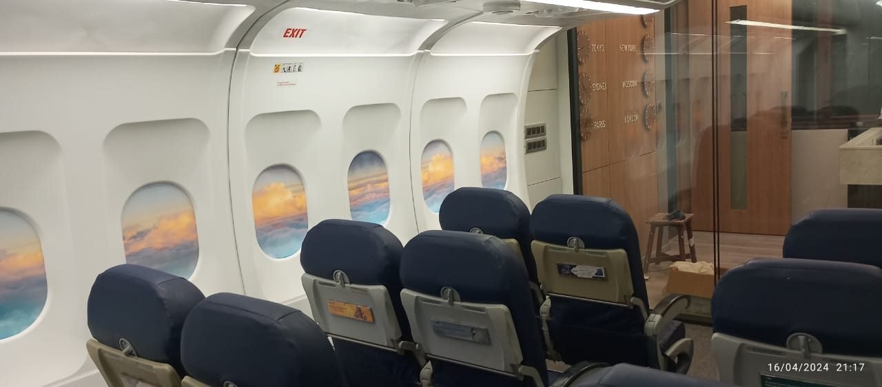 Cabin trainer styled as an airline lounge with window graphics