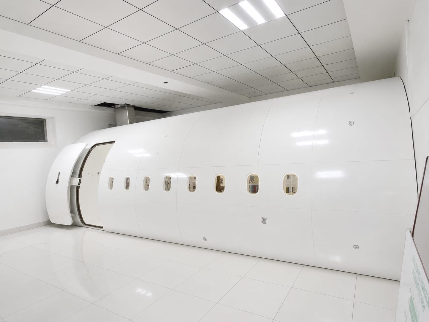 Unpainted fuselage shell ahead of client branding