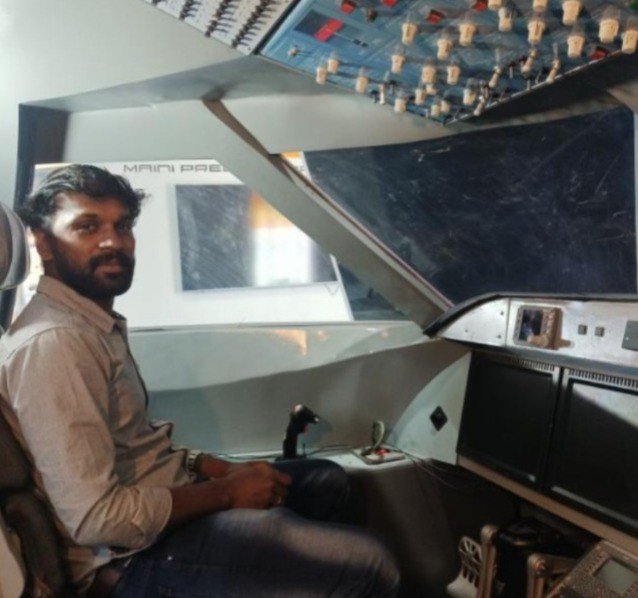 RajaRajan, Founder and CEO of AeroZjet Aviation, in an aircraft mock-up cockpit